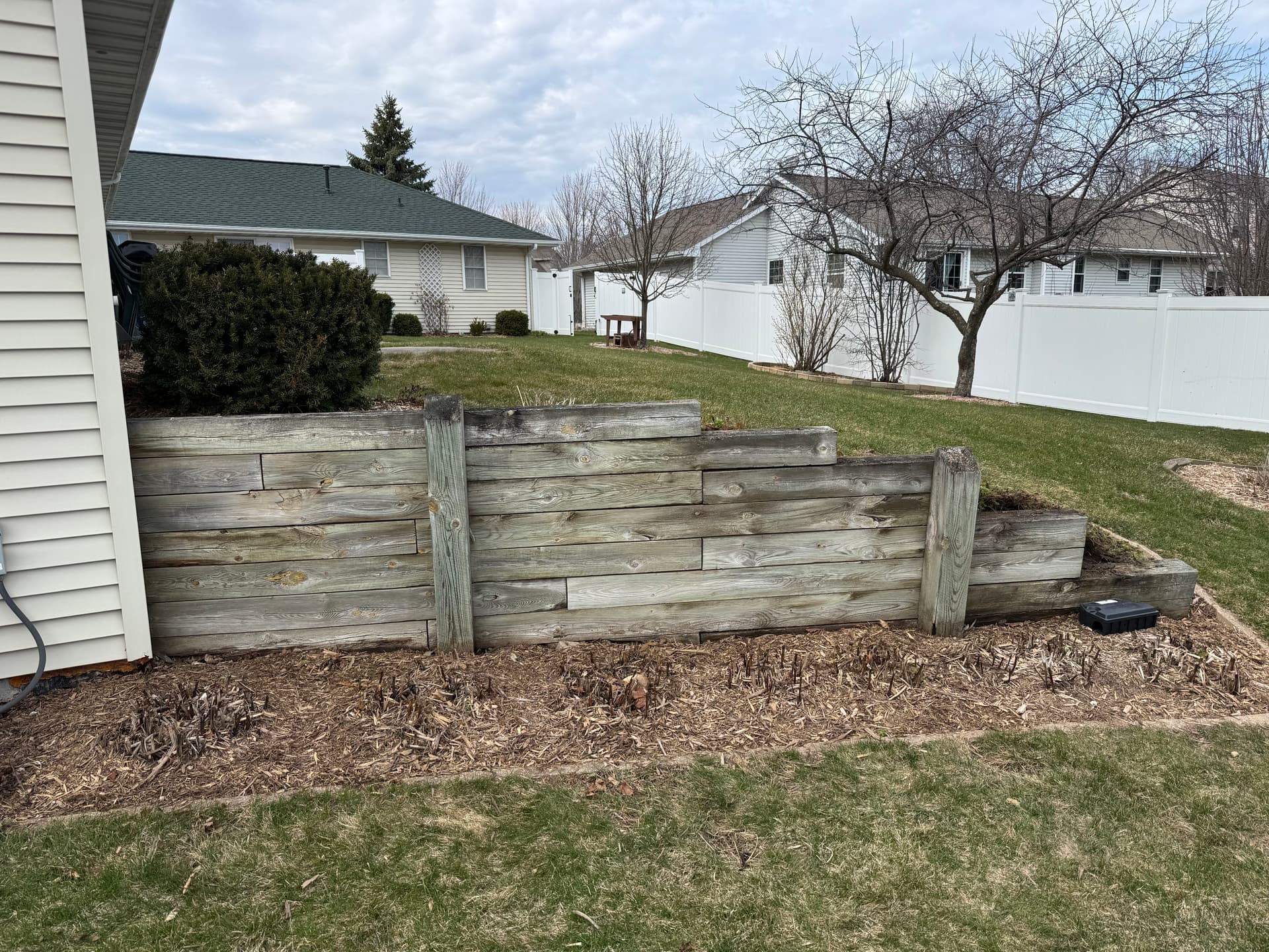 Old Timber Retaining Wall Replaced with Solid Stone image